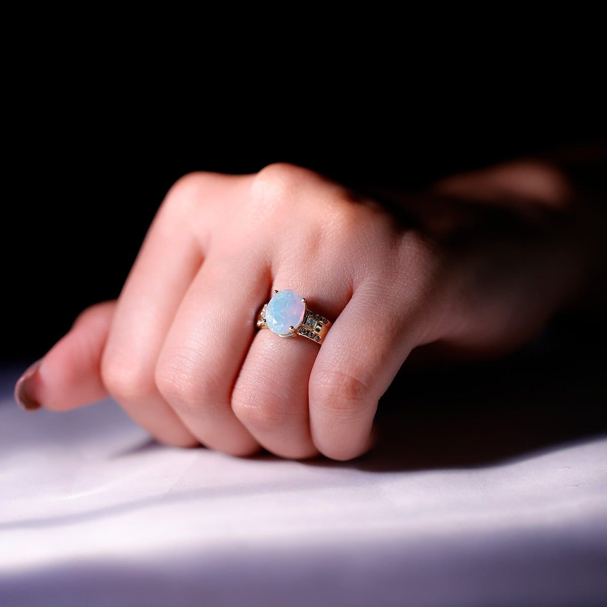 Ethiopian opal engagement ring with an oblong 1.3 carat opal and diamond accents, crafted by Rosec Jewels.