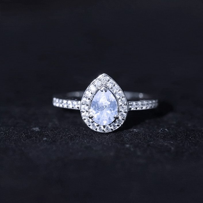 Elegant zircon teardrop halo engagement ring by Rosec Jewels featuring a sparkling central stone and intricate band detail.
