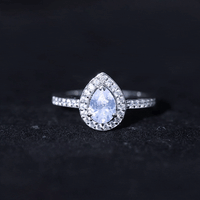 Elegant zircon teardrop halo engagement ring by Rosec Jewels featuring a sparkling central stone and intricate band detail.