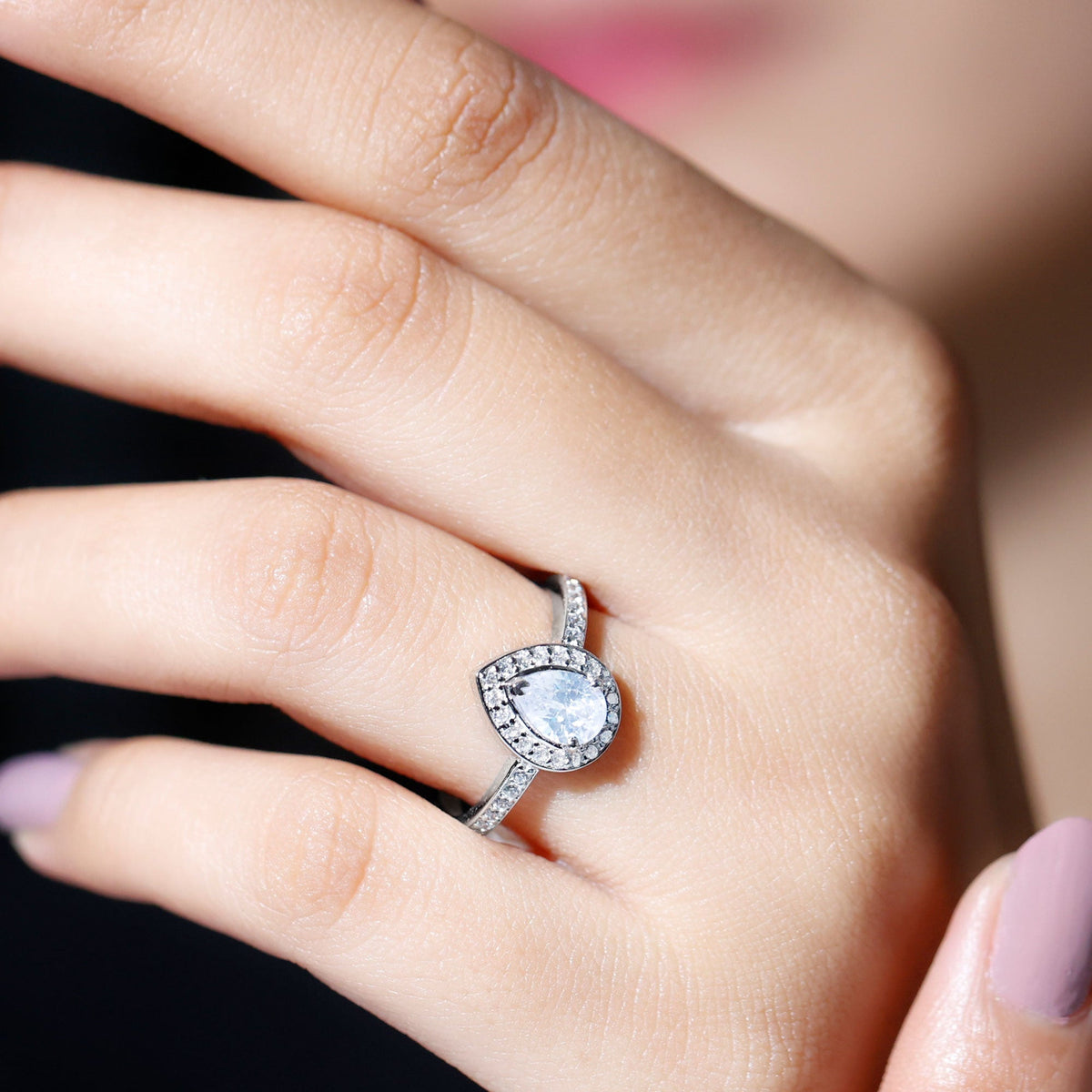 Sterling silver Zircon teardrop halo engagement ring with intricate detailing, designed by Rosec Jewels.
