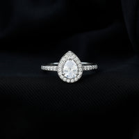 Rosec Jewels zircon teardrop halo engagement ring featuring a central teardrop-shaped zircon stone and intricate halo design.