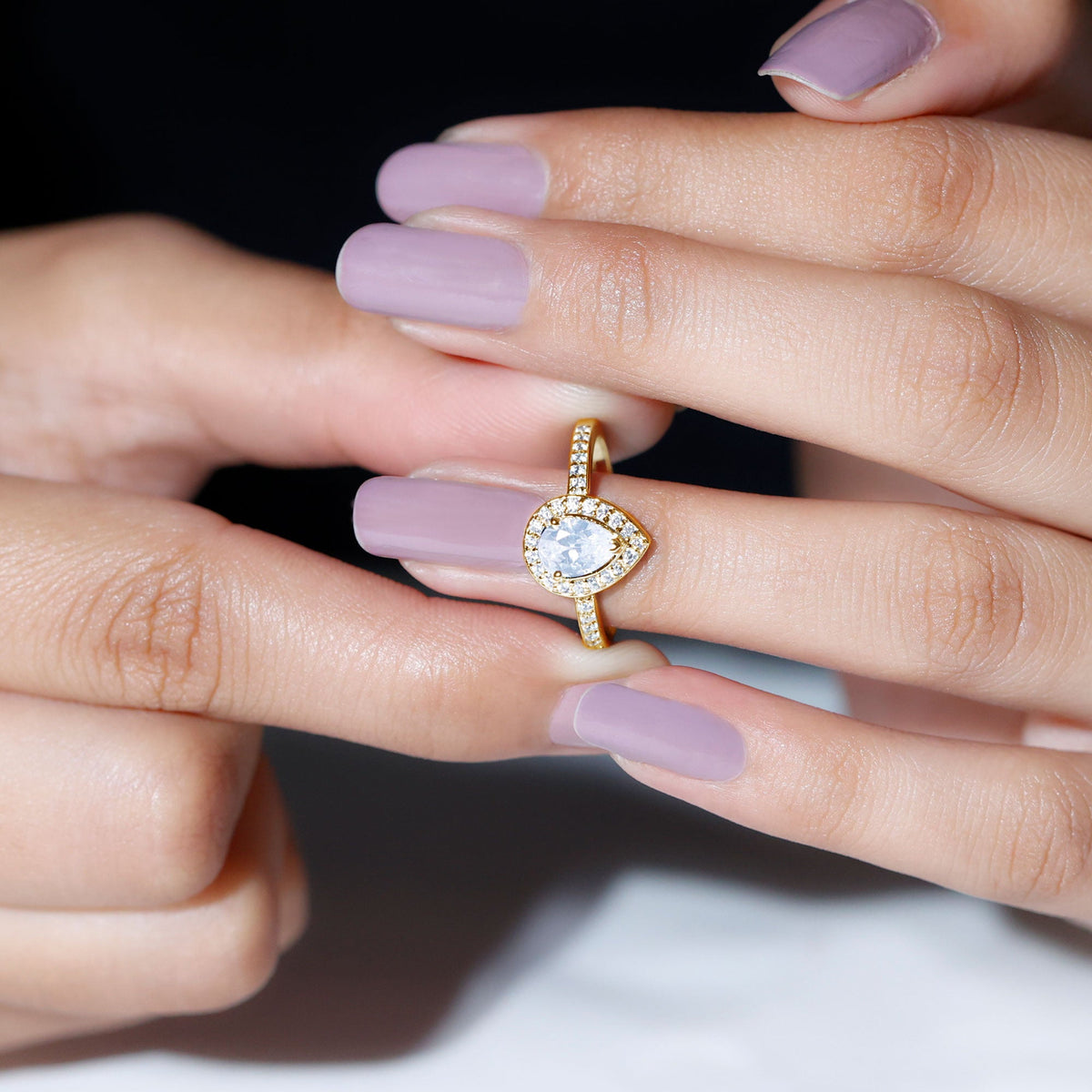 Rosec Jewels zircon teardrop halo engagement ring with intricate band and sparkling teardrop-shaped zircon center setting.
