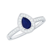 Genuine 0.5 carat blue sapphire and diamond pear halo engagement ring by Rosec Jewels, showcasing the detailed setting and elegant design.