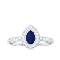 Genuine 0.5 carat blue sapphire and diamond pear halo engagement ring from Rosec Jewels showcasing a sparkling sapphire center and diamond accents.