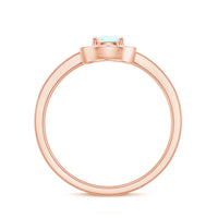 Natural 5x7mm opalescent teardrop engagement ring with diamond halo, showcasing a sparkling, elegant jewelry piece.
