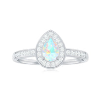 Natural 5x7mm opalescent teardrop engagement ring with diamond halo and rose gold band, showcasing elegant design and sparkling accents.