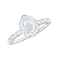 Rosec Jewels 1.25 CT moonstone and diamond halo engagement ring with intricate band and sparkling center stone.