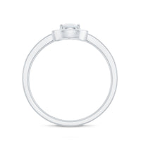 1.25 CT moonstone and diamond halo engagement ring by Rosec Jewels featuring a round moonstone center stone with diamond accents.