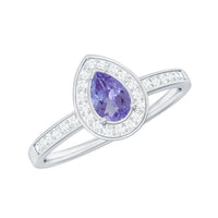 Natural pear-cut tanzanite engagement ring with diamond halo, featuring rose gold band, by Rosec Jewels.