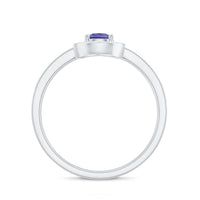 Natural pear cut tanzanite engagement ring with diamond halo, featuring a teardrop shape and elegant design from Rosec Jewels.