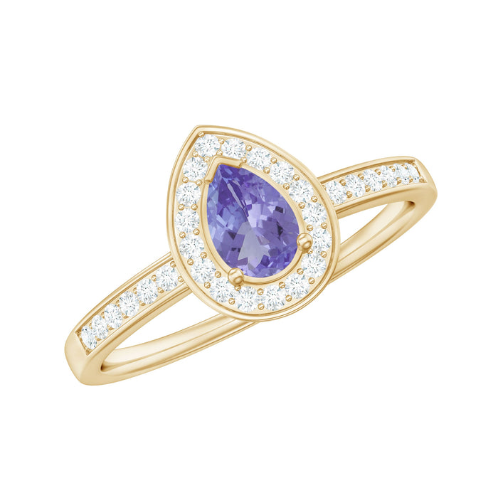 Natural pear cut tanzanite engagement ring with diamond halo, featuring a Rosec Jewels ring setting and intricate design.