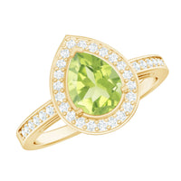 Natural 1 Carat Peridot teardrop engagement ring with diamond halo from Rosec Jewels, featuring a gold band and intricate design.