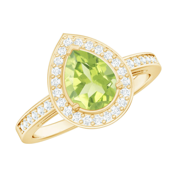 Natural 1 Carat Peridot teardrop engagement ring with diamond halo from Rosec Jewels, featuring a gold band and intricate design.