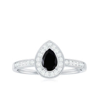 Genuine black spinel teardrop engagement ring with diamond halo from Rosec Jewels, showcasing the elegant ring design and sparkling stones.