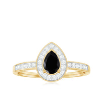 Genuine black spinel teardrop engagement ring with diamond halo from Rosec Jewels, featuring a stunning black gemstone and sparkling diamonds.