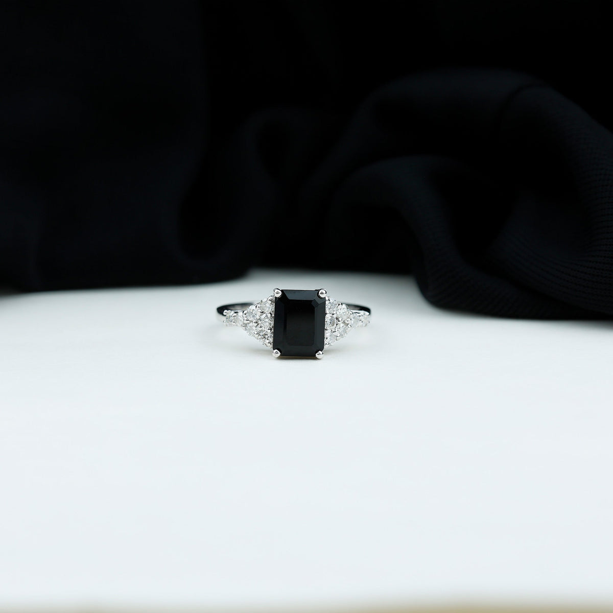 Black onyx engagement ring with emerald cut and diamond accents by Rosec Jewels, showing the detailed design and craftsmanship.