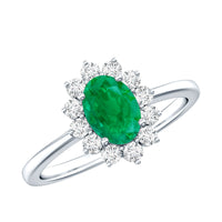 Natural 5x7mm emerald oval engagement ring with diamond halo by Rosec Jewels, showcasing a stunning gemstone and intricate setting.