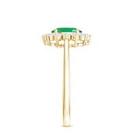 Natural 5x7mm emerald oval engagement ring with diamond halo by Rosec Jewels, showcasing a detailed view of the ring design.