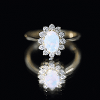 Certified real Ethiopian opal oval engagement ring with diamond halo from Rosec Jewels, showcasing a stunning gemstone and intricate design.