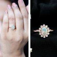 Certified real Ethiopian Opal oval engagement ring with diamond halo by Rosec Jewels, featuring a stunning colorful gemstone and sparkling diamonds.