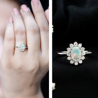 Certified real Ethiopian opal oval engagement ring with diamond halo, showcasing a stunning gemstone and elegant design by Rosec Jewels.