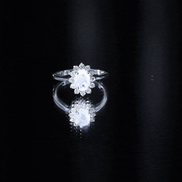 Princess Diana inspired moonstone engagement ring with diamond halo, featuring elegant design from Rosec Jewels.
