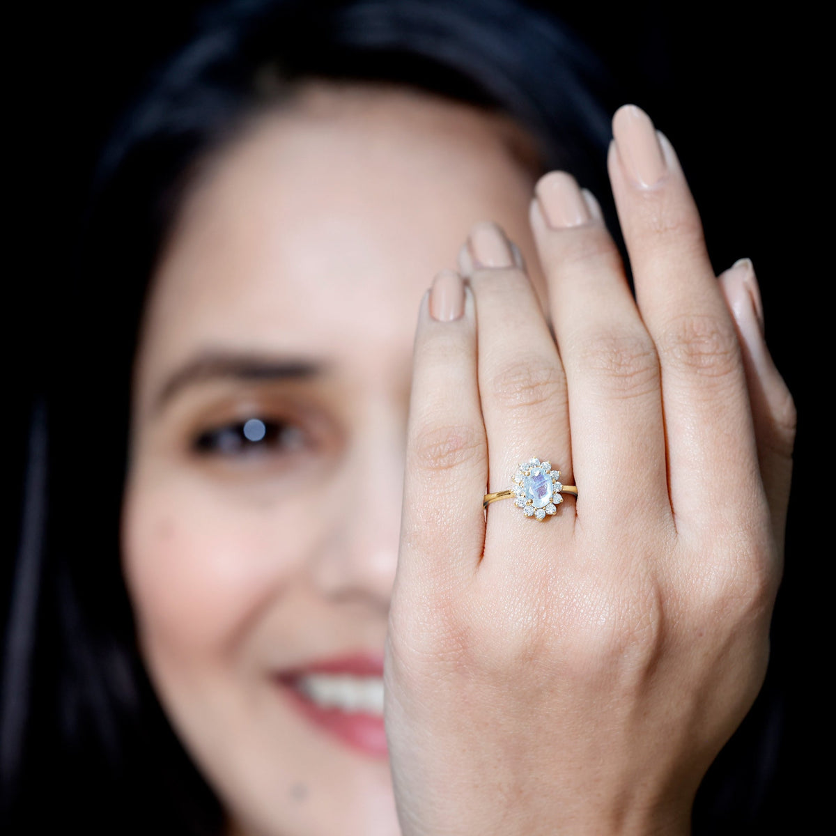 Princess Diana-inspired moonstone engagement ring with diamond halo from Rosec Jewels, showcasing a luminous moonstone and sparkling diamond accents.
