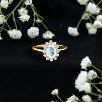 Princess Diana inspired moonstone engagement ring with diamond halo, featuring a vintage-style ring from Rosec Jewels.