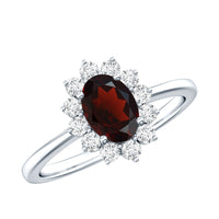 Natural garnet 6x8mm oblong engagement ring with diamond halo from Rosec Jewels, showcasing a detailed setting and sparkling stones.