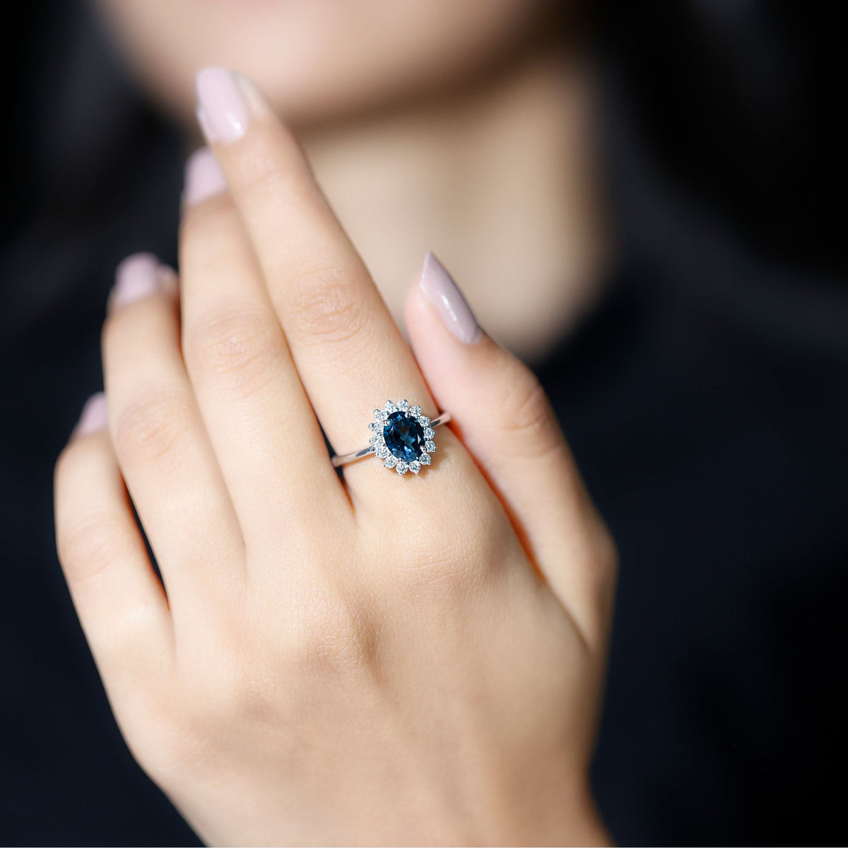 Rosec Jewels London Blue Topaz Princess Diana inspired engagement ring with a 1-carat blue topaz and diamond accents.