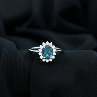Rosec Jewels 1 Carat London Blue Topaz princess cut engagement ring with diamond, inspired by Princess Diana, featuring intricate band details.