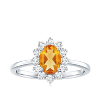 Real 6x8mm citrine oval engagement ring with diamond halo from Rosec Jewels, featuring a gold band and intricate design.