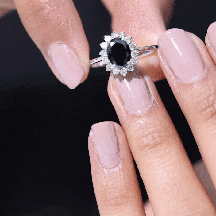 Oval cut black onyx engagement ring with diamond halo from Rosec Jewels, showcasing the elegant ring design and gemstone details.