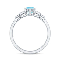 Rosec Jewels 6x8mm aquamarine engagement ring with a diamond accent, featuring a sleek sterling silver band.