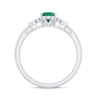 Natural emerald and diamond engagement ring for her featuring a central emerald surrounded by sparkling diamonds, set in a elegant ring.