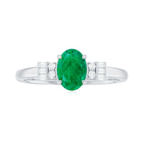 Natural emerald and diamond engagement ring for her featuring a central emerald gem surrounded by diamonds, set in a elegant ring design.