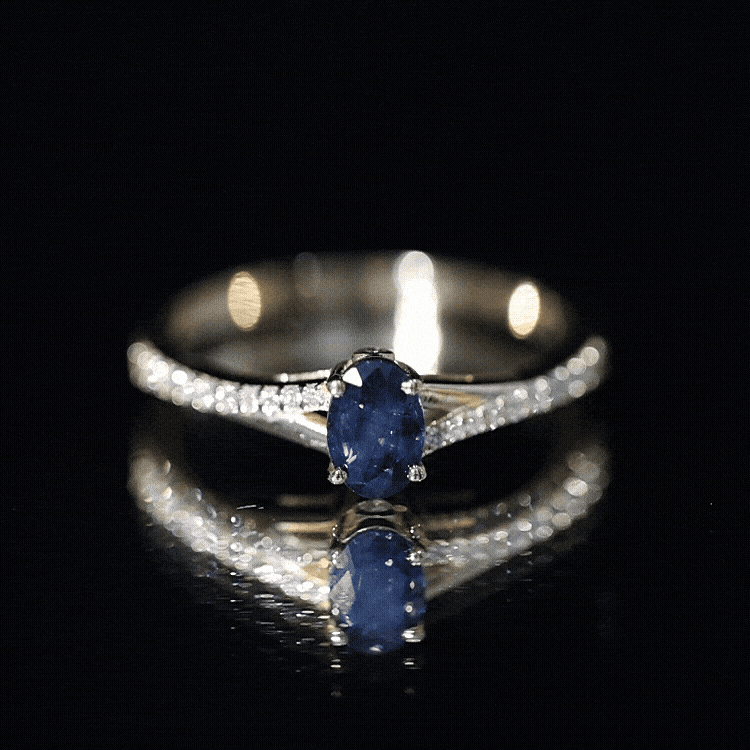 Natural 0.6 carat blue sapphire engagement ring with diamond split shank by Rosec Jewels, showcasing the ring's elegant design.