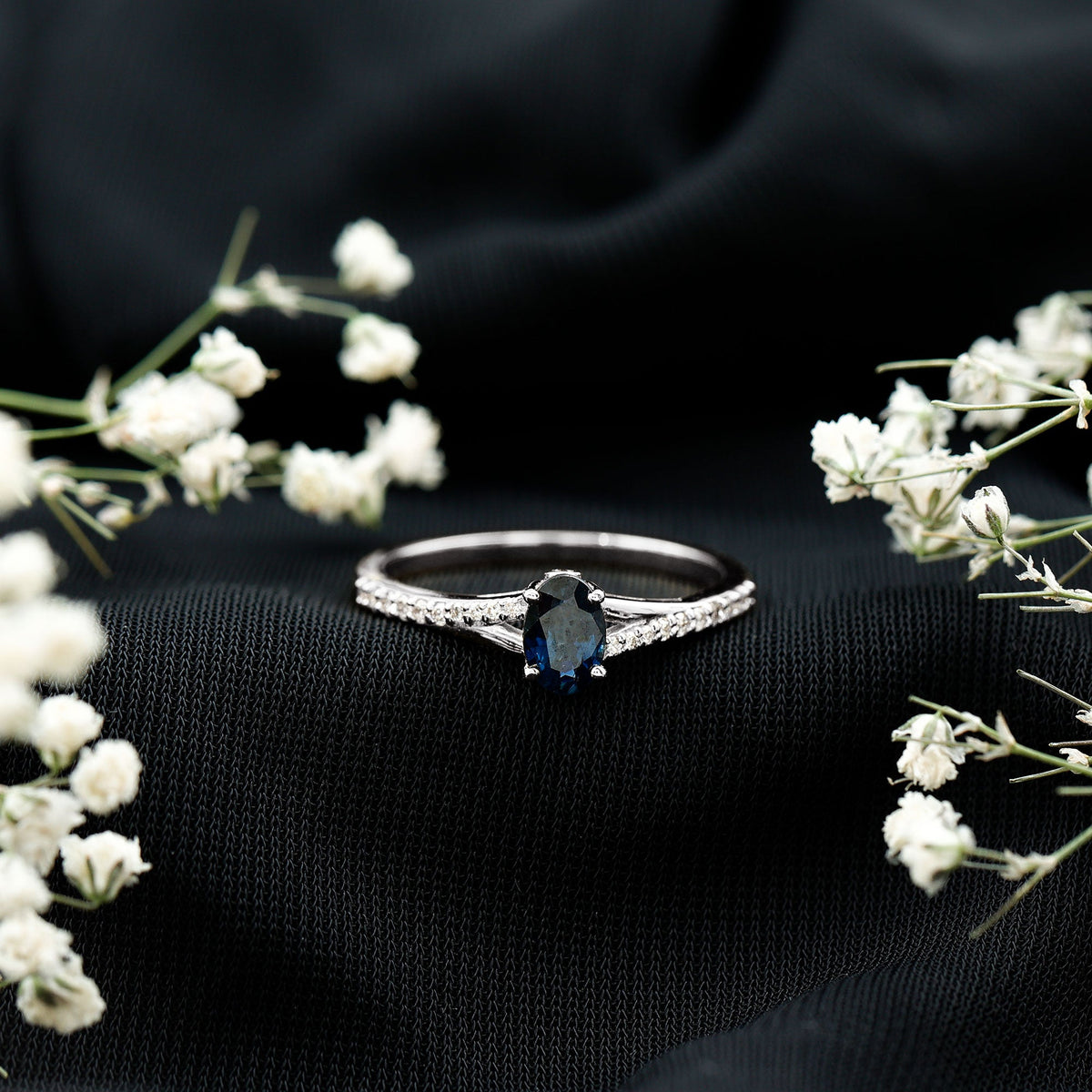 Natural 0.6 carat blue sapphire engagement ring with diamond split shank from Rosec Jewels, featuring a sleek, minimal design.