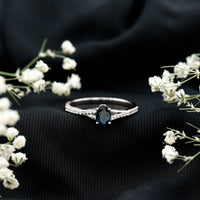 Natural 0.6 carat blue sapphire engagement ring with diamond split shank from Rosec Jewels, featuring a sleek, minimal design.