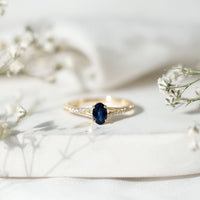 Natural 0.6 carat blue sapphire engagement ring with diamond split shank from Rosec Jewels, showcasing elegant design and fine craftsmanship.