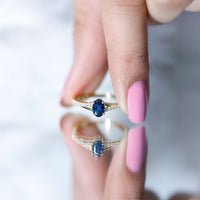 Natural 0.6 carat blue sapphire engagement ring with diamond split shank by Rosec Jewels, featuring a sleek gold band and elegant design.