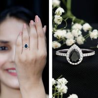 Lab grown black diamond teardrop engagement ring with white diamond halo by Rosec Jewels, featuring 0.85 carats.