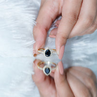 Black diamond teardrop engagement ring with white diamond halo from Rosec Jewels, featuring a 0.85 carat lab-grown gemstone.