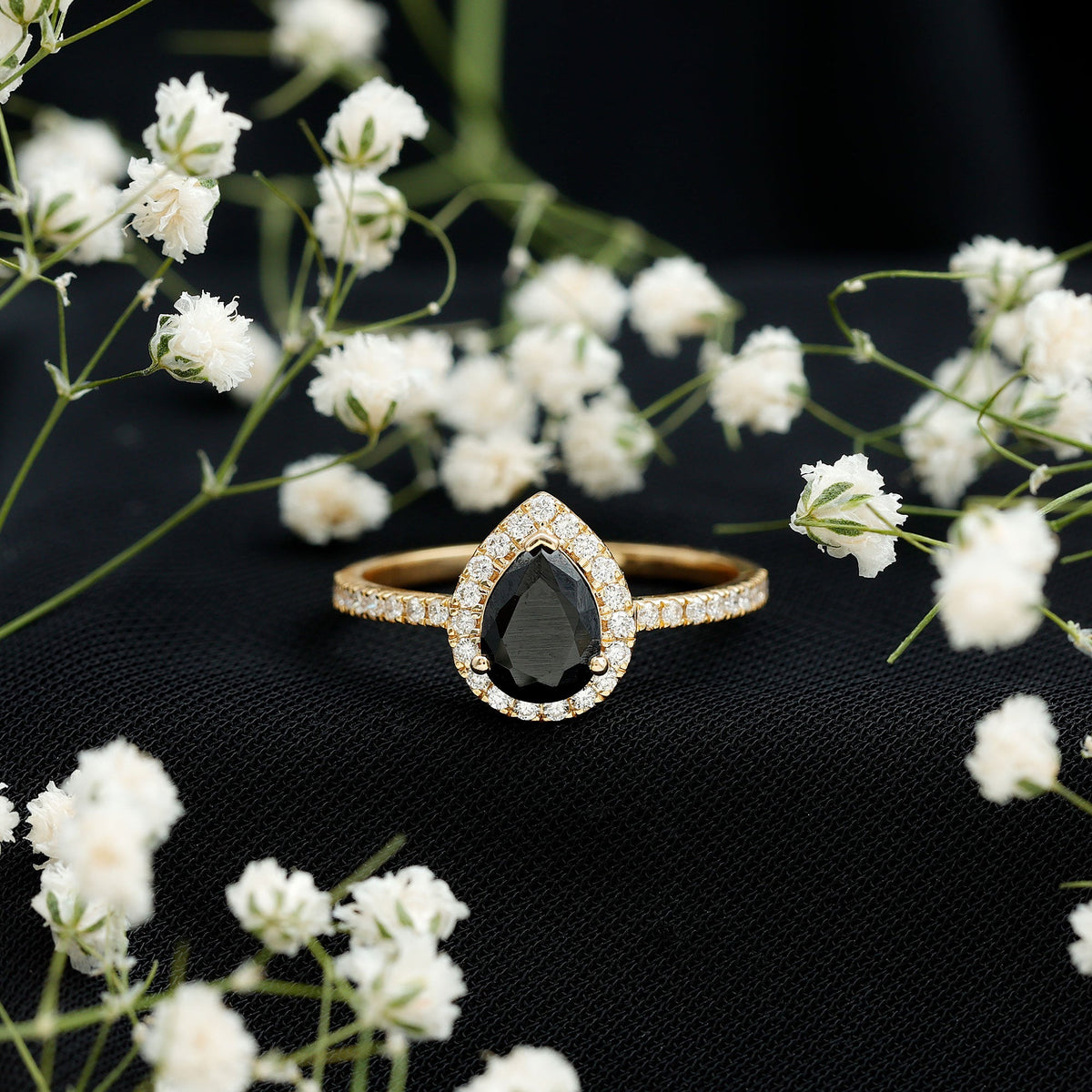 Lab grown black diamond teardrop engagement ring with white diamond halo, featuring Rosec Jewels branding, shown on a white background.