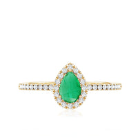 Pear-shaped emerald engagement ring with diamond halo, 0.3 carats, featuring a rose gold band and intricate detailing.