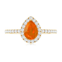Genuine fire opal teardrop ring with diamond halo by Rosec Jewels, featuring a vibrant orange fire opal and sparkling diamond accents.