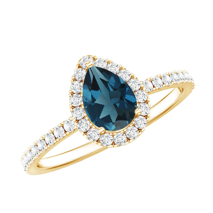 Pear-shaped London Blue Topaz engagement ring with Moissanite halo, set in a rose gold band, featuring a 0.7-carat center stone.