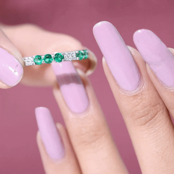 Yellow gold eternity wedding band with lab-grown emerald and diamond accents by Rosec Jewels