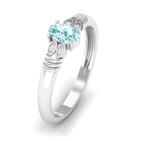 Natural aquamarine oval engagement ring with 6x8mm gemstone and diamond accents by Rosec Jewels.