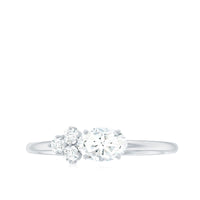 Oval and round moissanite promise ring for her featuring sparkling stones set in a elegant rose gold band by Rosec Jewels.